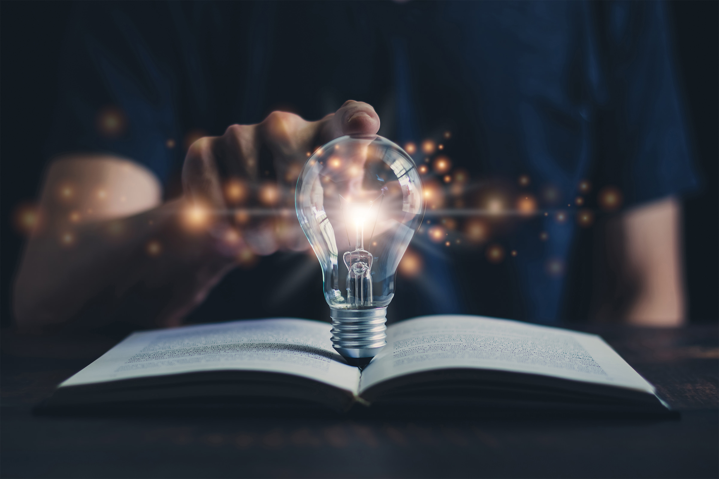 Glowing light bulb and book or text book with futuristic icon. Self learning or education knowledge and business studying concept. Idea of learning online class or e-learning at home.